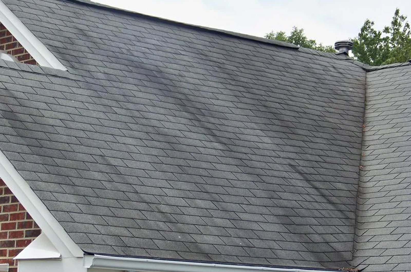 Algae growing on a roof showing up as dark streaks