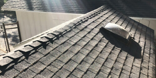 A roof that was cleaned of roof moss during winter