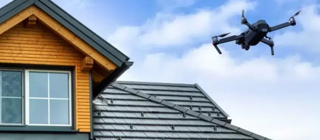A drone flying over a southern Oregon home to inspect for roof moss