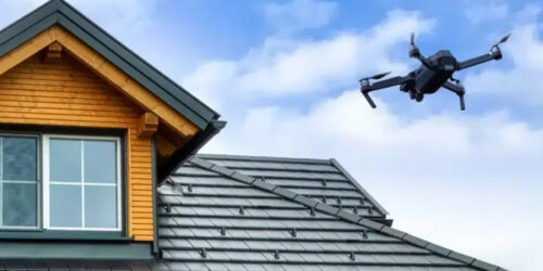 A drone flying over a southern Oregon home to inspect for roof moss