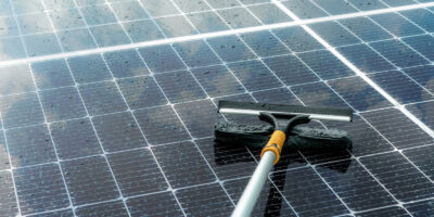 A Solar Panel cleaning brush on panels