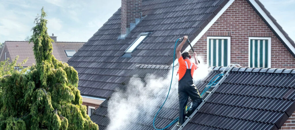 Man cleaning a roof in Ashland, Oregon