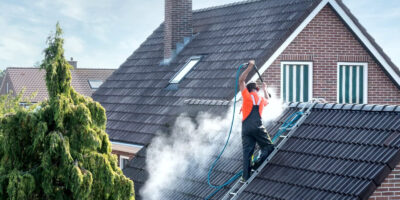 Man cleaning a roof in Ashland, Oregon