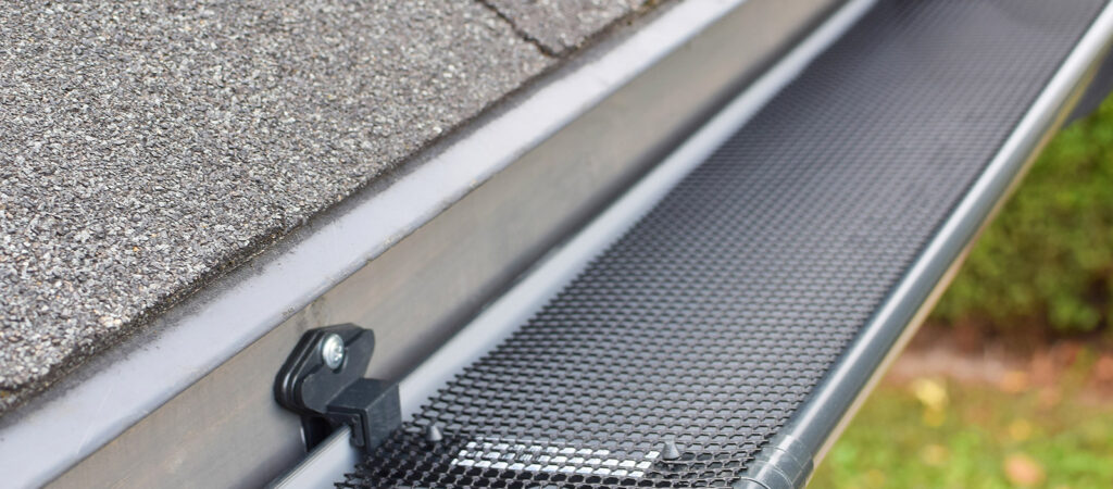 A gutter with gutter guards installed