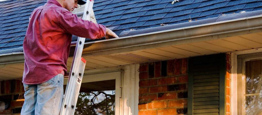 Man doing roof maintenance checklist on a home in Southern Oregon