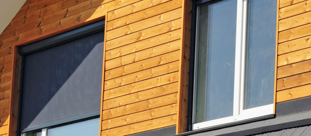 Close up of two clean windows with screens and frames