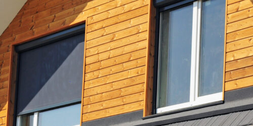 Close up of two clean windows with screens and frames