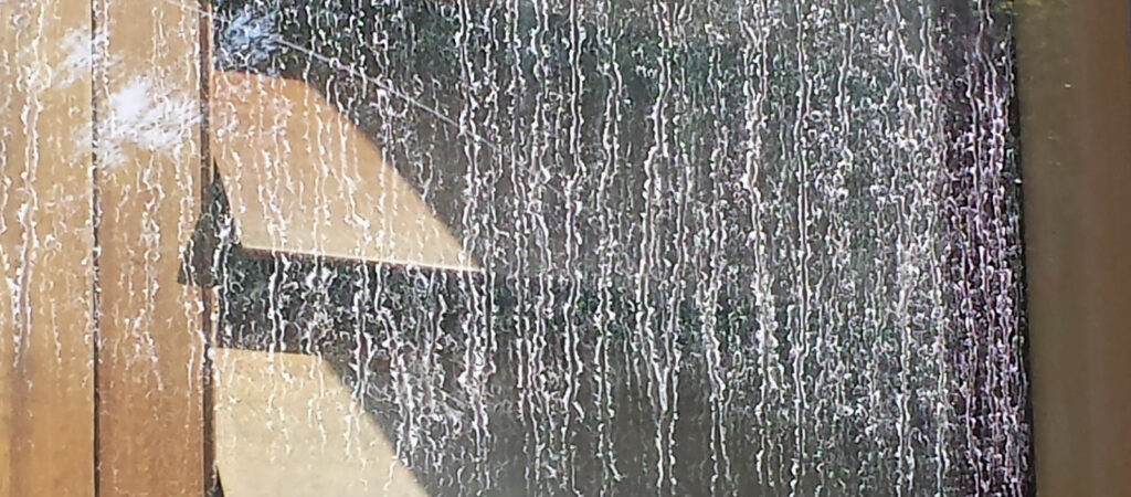 Hard water spots on a window in Southern Oregon